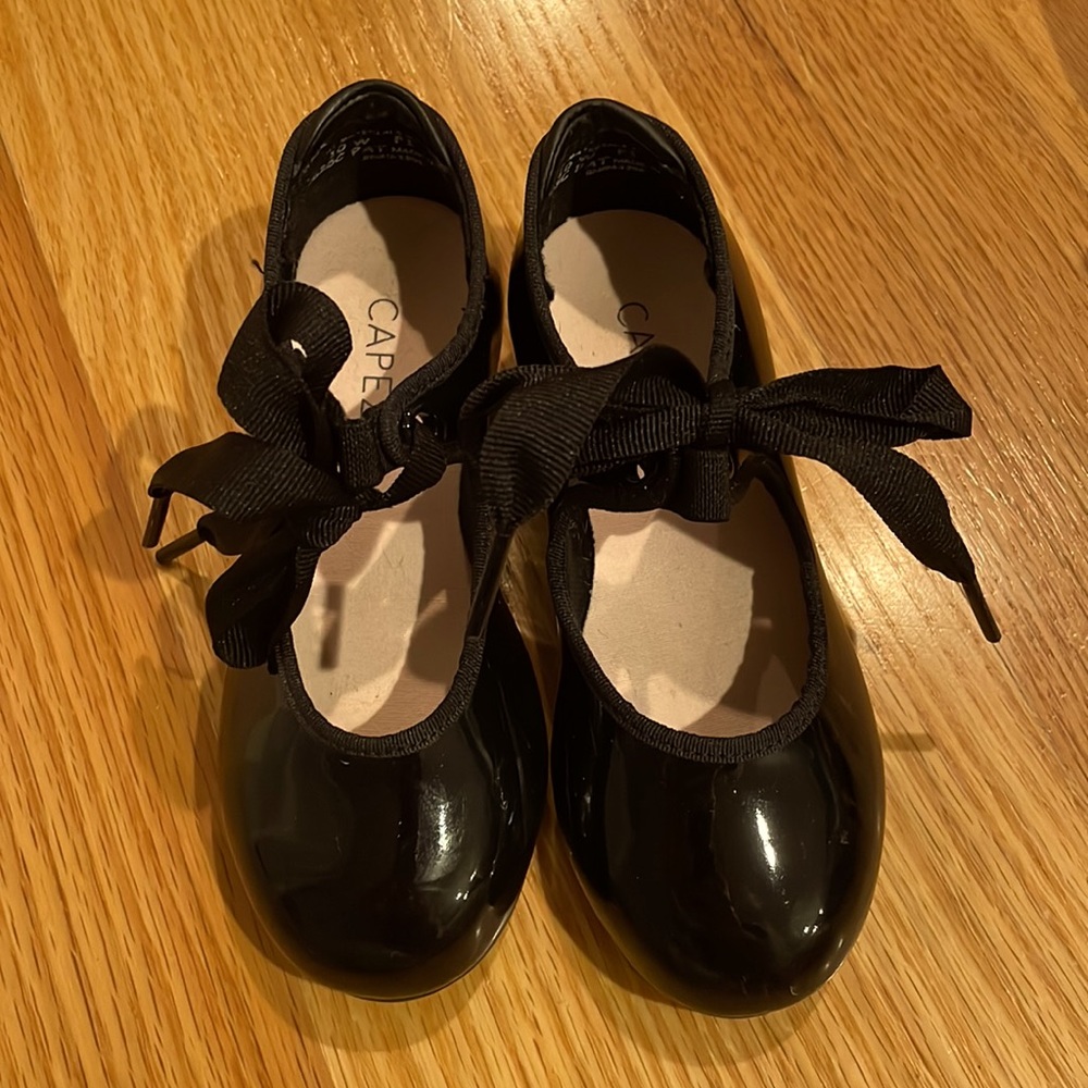 Black Capezio tap shoes.